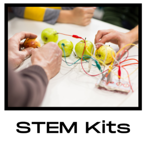 Three sets of hands on a table plugging electrodes into an apple